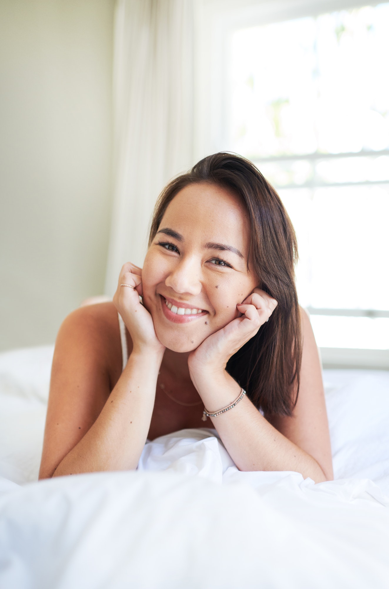 Im such a morning person. Shot of an attractive young woman lying on her bed in the morning.